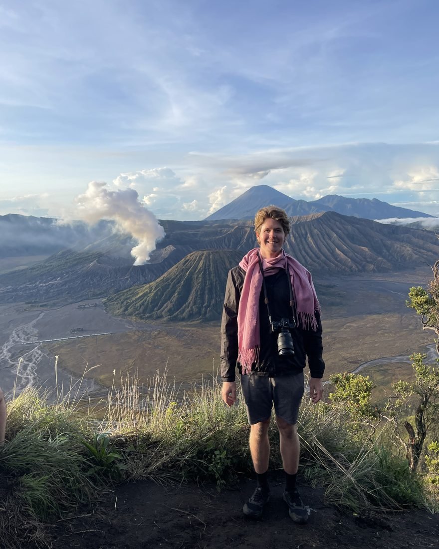 Brandon on a mountain ridge overlooking volcanoes